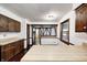 Bright kitchen featuring wood cabinets, light countertops, and an open layout that connects seamlessly to other rooms at 1660 Obara Ct, Carmel, IN 46033
