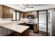 Well-lit kitchen with stainless steel appliances, wooden cabinets, and functional layout at 1660 Obara Ct, Carmel, IN 46033
