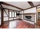 Comfortable living room with hardwood floors, brick fireplace, and large windows at 1660 Obara Ct, Carmel, IN 46033