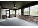 Sunroom features brick walls, large windows offering backyard views, and access to the outside at 1660 Obara Ct, Carmel, IN 46033