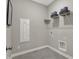 Functional laundry room with shelving and utility connections at 17030 Daly Dr, Noblesville, IN 46062