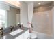 This bathroom features a large vanity with a neutral countertop and a shower and tub combo at 17050 Daly Dr, Noblesville, IN 46062
