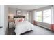 Bright bedroom with large windows, neutral walls, and plush carpet, creating a cozy and inviting space at 17050 Daly Dr, Noblesville, IN 46062