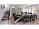 Inviting living room featuring a cozy fireplace, comfortable seating, and large windows with natural lighting at 17050 Daly Dr, Noblesville, IN 46062