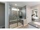 This bathroom features a large tiled glass shower with a built in bench at 17050 Daly Dr, Noblesville, IN 46062