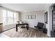 Inviting study with a large window, neutral tones, and stylish furniture creates a perfect work from home space at 17050 Daly Dr, Noblesville, IN 46062