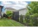 Landscaped backyard with privacy fence and lush green lawn at 2105 Granville Dr, Westfield, IN 46074