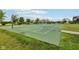Community basketball court on a sunny day, surrounded by lush green lawns and neighborhood homes at 2105 Granville Dr, Westfield, IN 46074