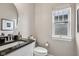 Charming powder room with granite counters, modern fixtures, and plenty of natural light at 2105 Granville Dr, Westfield, IN 46074