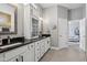 Modern bathroom featuring double sink vanity, granite countertops, and a view to the bedroom at 2105 Granville Dr, Westfield, IN 46074