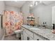 Cheerful bathroom features granite counters and unique, colorful shower curtain at 2105 Granville Dr, Westfield, IN 46074