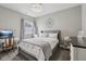 Relaxing bedroom with a stylish chandelier, carpet flooring, grey walls and ample natural light at 2105 Granville Dr, Westfield, IN 46074
