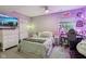 This room is illuminated with soft purple lighting, creating a cozy and whimsical atmosphere at 2105 Granville Dr, Westfield, IN 46074