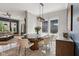 Elegant dining area with modern light fixture, seating for six, and natural light at 2105 Granville Dr, Westfield, IN 46074