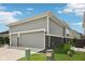 Charming home exterior featuring a three-car garage and well-maintained lawn at 2105 Granville Dr, Westfield, IN 46074