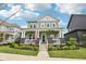 Attractive two-story home with a covered front porch and well-maintained lawn at 2105 Granville Dr, Westfield, IN 46074