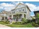 Inviting two-story home with a cozy front porch and meticulously manicured garden at 2105 Granville Dr, Westfield, IN 46074