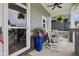 Cozy front porch with rocking chairs, hanging ferns, and an American flag for added curb appeal at 2105 Granville Dr, Westfield, IN 46074