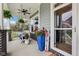 Inviting front porch featuring a swing, ferns, and patriotic decor for a welcoming atmosphere at 2105 Granville Dr, Westfield, IN 46074