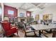 Inviting game room featuring cozy seating, a fireplace, and several tables for recreation at 2105 Granville Dr, Westfield, IN 46074