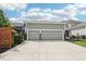 Three car garage with driveway and lush lawn at 2105 Granville Dr, Westfield, IN 46074