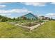 Community garden with neat raised beds and thriving greenery, promoting sustainable living at 2105 Granville Dr, Westfield, IN 46074