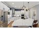 Modern kitchen with stainless steel appliances, white cabinetry, and quartz countertops at 2105 Granville Dr, Westfield, IN 46074