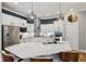 Bright kitchen featuring stainless steel appliances, island with seating, and designer lighting at 2105 Granville Dr, Westfield, IN 46074