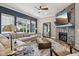 Spacious living room featuring stone fireplace, large sectional couch, and stylish decor elements at 2105 Granville Dr, Westfield, IN 46074