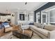 Bright living room featuring a large sectional, designer rug, and an open layout at 2105 Granville Dr, Westfield, IN 46074