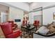Comfortable lounge area with red leather chairs and a striking stone fireplace feature at 2105 Granville Dr, Westfield, IN 46074