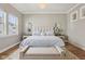 Comfortable bedroom featuring soft lighting, large windows, stylish bed and a bench at 2105 Granville Dr, Westfield, IN 46074
