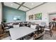 Well-lit meeting room with multiple tables and comfortable seating arrangements for gatherings at 2105 Granville Dr, Westfield, IN 46074
