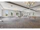 Large, airy multi-purpose room with high ceilings, chandeliers, large windows, and neutral colors with tables setup at 2105 Granville Dr, Westfield, IN 46074
