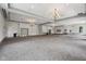 A spacious multi-purpose room with neutral tones, tall ceilings, elegant chandeliers and a projector at 2105 Granville Dr, Westfield, IN 46074