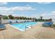 Community pool with bright blue lounge chairs around a cool blue pool at 2105 Granville Dr, Westfield, IN 46074