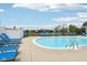 Blue community swimming pool surrounded by lounge chairs at 2105 Granville Dr, Westfield, IN 46074