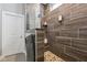 Luxurious walk-in shower with mosaic flooring and pebble accents, including a built-in seat at 2105 Granville Dr, Westfield, IN 46074