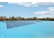 Bright blue tennis courts in a well-maintained community perfect for recreational play at 2105 Granville Dr, Westfield, IN 46074