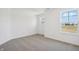 Bright bedroom with neutral carpet, natural light and a view to the outdoors at 2151 Bear Oak Way, Shelbyville, IN 46176