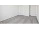 A bright bedroom features neutral carpeting and a closet with sliding doors at 2151 Bear Oak Way, Shelbyville, IN 46176