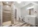 Modern bathroom featuring a glass-enclosed shower, updated vanity, and stylish fixtures, designed for comfort at 2170 S East St, Indianapolis, IN 46225