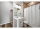 Bathroom featuring modern vanity, updated fixtures, and stylish wood-look tile accent wall at 2170 S East St, Indianapolis, IN 46225