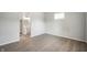 Bright bedroom featuring neutral paint, plush carpeting, and an attached bathroom for added convenience at 2170 S East St, Indianapolis, IN 46225