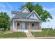 Charming two-story home with a welcoming front porch and well-maintained landscaping at 2170 S East St, Indianapolis, IN 46225