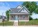 Charming two-story home with a welcoming front porch and well-maintained landscaping at 2170 S East St, Indianapolis, IN 46225