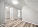 Hallway featuring updated flooring and fresh paint, creating a bright and welcoming transition space at 2170 S East St, Indianapolis, IN 46225
