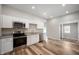Modern kitchen featuring stainless steel appliances, granite countertops, and ample cabinet space at 2170 S East St, Indianapolis, IN 46225