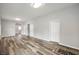 Bright living room featuring hardwood floors, ample natural light, and neutral paint at 2170 S East St, Indianapolis, IN 46225