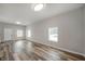 Bright living room featuring hardwood floors, ample natural light, and neutral paint at 2170 S East St, Indianapolis, IN 46225
